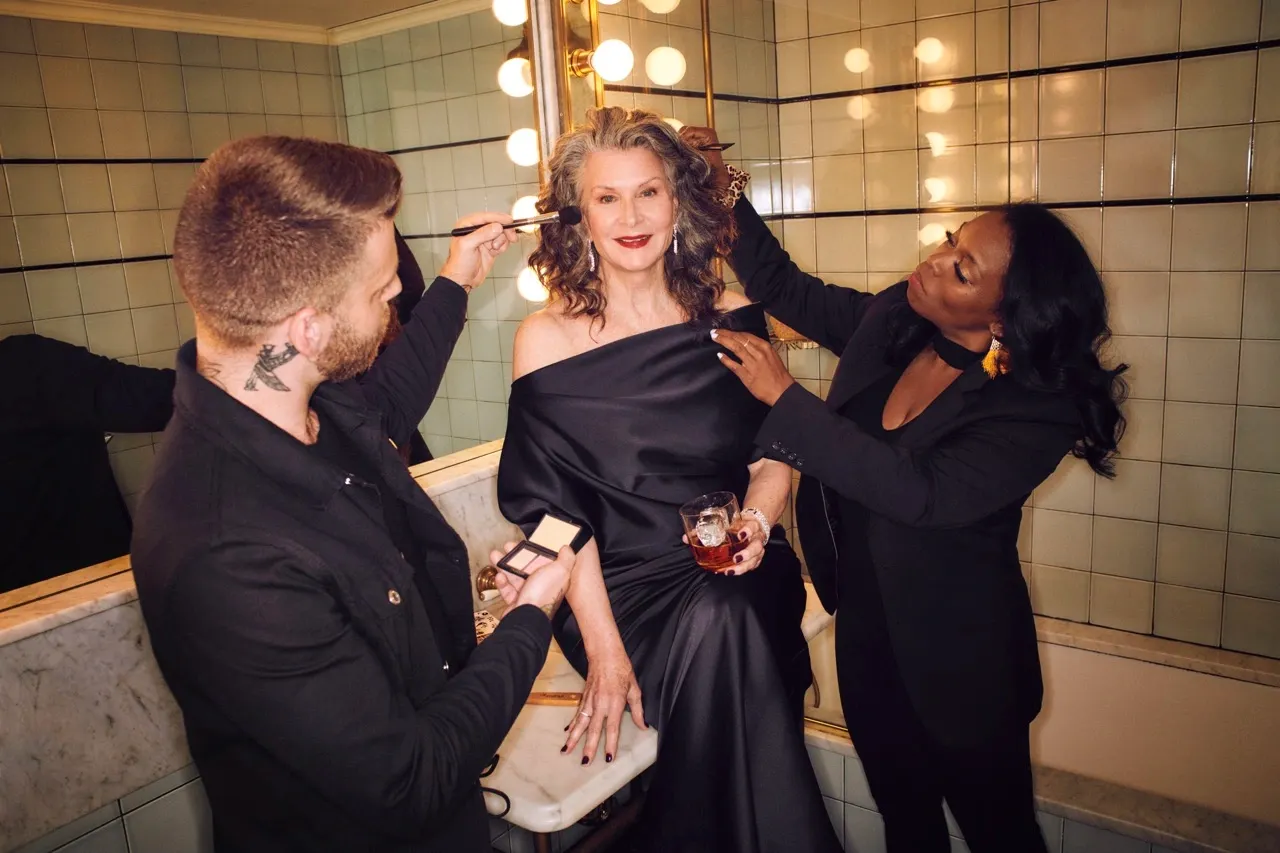 Makeup trial for the wedding day applied to elegant woman in black satin gown