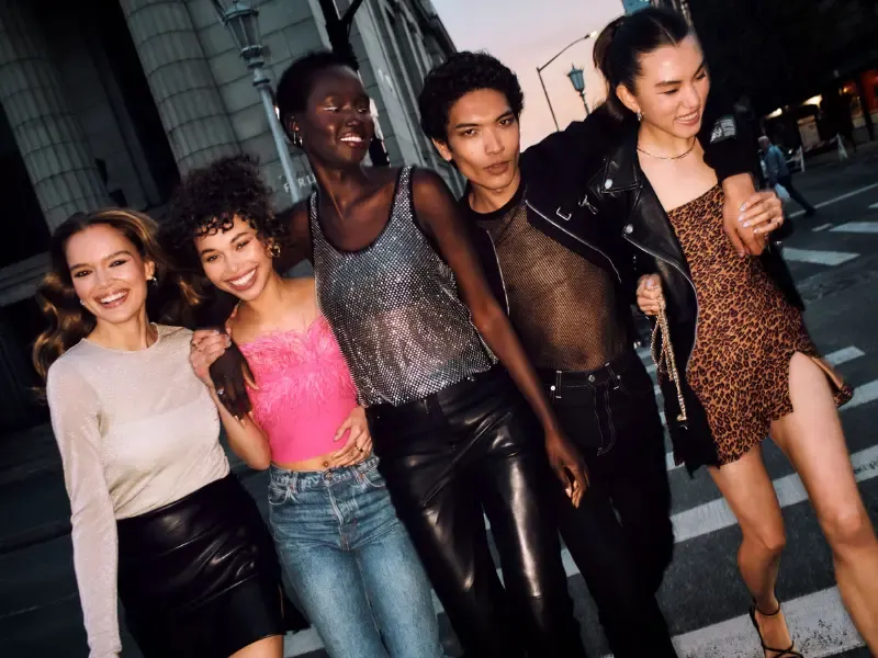 Party makeup ideas showcased by stylish friends with bold evening looks walking together through city streets at night